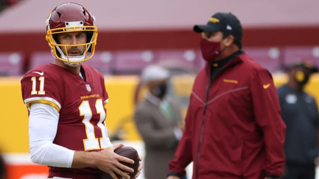 Former Washington quarterback Alex Smith and head coach Ron Rivera.